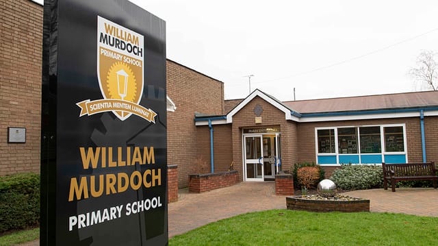 The entrance and sign outside William Murdoch Primary School.