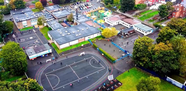 Aerial view of William Murdoch Primary School and its playgrounds.