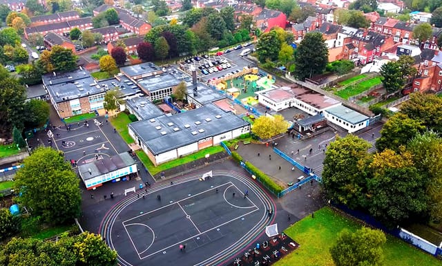 Aerial view of William Murdoch Primary School and its playgrounds.